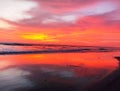 Beautiful sunset on the beach with red sky Royalty Free Stock Photo