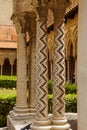 Cloister of the Benedictine monastery in the Cathedral of Monreale in Sicily. General view and details of the columns and capitals