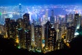 The most famous view of Hong Kong at twilight sunset. Hong Kong skyscrapers skyline cityscape view from Victoria Peak illuminated Royalty Free Stock Photo