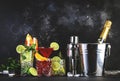 Most popular cocktail drinks set: aperol spritz, negroni, mojito, gin tonic and cosmopolitan on black bar counter background with Royalty Free Stock Photo