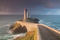 Most popular lighthouse in Europe during stormy weather. Petit Minou Lighthouse at sunset with red light, Brest , France Royalty Free Stock Photo