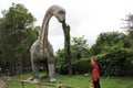 The most scary dinosaur huge sculpture placed in a park photograph