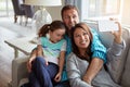 The most treasured memories are made with family. a happy young family taking selfies together on the sofa at home. Royalty Free Stock Photo