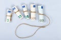 The most used euro bills for Europeans tied with a rope and isolated on white Royalty Free Stock Photo