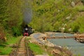 Steam train named Mocanita in Vaser Valley, Maramures, Romania. in spring time Royalty Free Stock Photo