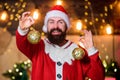 Most wonderful time of year. Decorations shop. Winter decorations. Shimmering balls christmas decorations. Bearded man Royalty Free Stock Photo