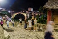 MOSTAR, BOSNIA AND HERZEGOVINA - JUNE 10, 2019: Night view of Stari most (Old Bridge) and old stone buildings in Royalty Free Stock Photo