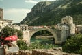 Old Bridge of Mostar during a sunny afternoon. This bridge, also called Stari Most, is the symbol of the war torn city