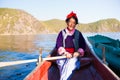 The Mosuo senior woman boating