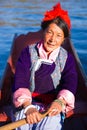 The Mosuo senior woman boating