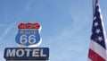 Motel retro sign on historic route 66 famous travel destination, vintage symbol of road trip in USA. Iconic lodging signboard in Royalty Free Stock Photo