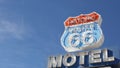 Motel retro sign on historic route 66 famous travel destination, vintage symbol of road trip in USA. Iconic lodging signboard in Royalty Free Stock Photo