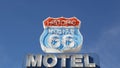 Motel retro sign on historic route 66 famous travel destination, vintage symbol of road trip in USA. Iconic lodging signboard in Royalty Free Stock Photo