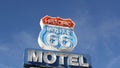 Motel retro sign on historic route 66 famous travel destination, vintage symbol of road trip in USA. Iconic lodging signboard in Royalty Free Stock Photo