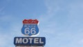 Motel retro sign on historic route 66 famous travel destination, vintage symbol of road trip in USA. Iconic lodging signboard in Royalty Free Stock Photo