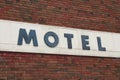 motel sign on motel writing caption text in blue wood capital letters. p Royalty Free Stock Photo