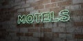 MOTELS - Glowing Neon Sign on stonework wall - 3D rendered royalty free stock illustration Royalty Free Stock Photo