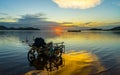 Motercycle parked on the waterfront with sunset at Bang phra reservoir ,sriracha chon buri,  thailand Royalty Free Stock Photo