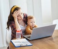 mother baby laptop computer child woman working business parent mom family Royalty Free Stock Photo