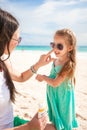 Mother apply sunblock cream on her little child Royalty Free Stock Photo