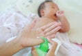 Mother are applying a lotion cream on the baby body after bath. Baby Care Concept Royalty Free Stock Photo