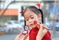 Mother applying makeup on her daughter face Royalty Free Stock Photo