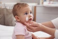 Mother applying moisturizing cream on her baby at home, closeup Royalty Free Stock Photo