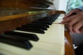 Mother assisting daughter in playing piano at home Royalty Free Stock Photo