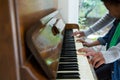 Mother assisting daughter in playing piano Royalty Free Stock Photo