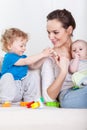 Mother and babies during free time Royalty Free Stock Photo