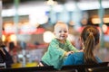 Mother And Baby At Airport.