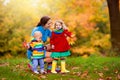 Mother and baby in autumn. Fall outdoor family fun Royalty Free Stock Photo