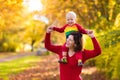 Mother and baby in autumn. Fall outdoor family fun. Royalty Free Stock Photo