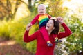 Mother and baby in autumn. Fall outdoor family fun. Royalty Free Stock Photo