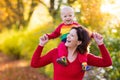 Mother and baby in autumn. Fall outdoor family fun. Royalty Free Stock Photo