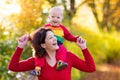 Mother and baby in autumn. Fall outdoor family fun. Royalty Free Stock Photo