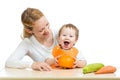 Mother with baby baby at table with pumpkin Royalty Free Stock Photo