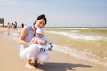 Mother with baby at the beach Royalty Free Stock Photo