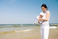 Mother with baby at the beach