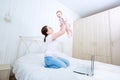 Mother and baby in bed.Child and parent together at home.Young m Royalty Free Stock Photo