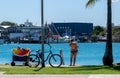 MOTHER, BABY, BIKE, BIKINI ENJOY THE SUN Royalty Free Stock Photo