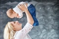 Mother and baby boy playing and smiling. Happy family. Copy space Royalty Free Stock Photo