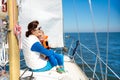 Family sailing. Mother and child on sea sail yacht Royalty Free Stock Photo