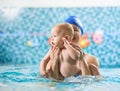 Mother with baby boy in swimming pool training Royalty Free Stock Photo