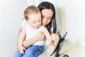 Mother and baby boy using digital tablet in Royalty Free Stock Photo