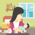 Mother with baby and breast pump.