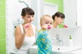 Mother with baby brushing teeth Royalty Free Stock Photo