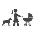 Mother with baby carriage walking with dog Royalty Free Stock Photo