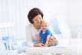 Mother and baby on changing table Royalty Free Stock Photo