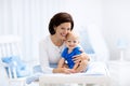 Mother and baby on changing table Royalty Free Stock Photo